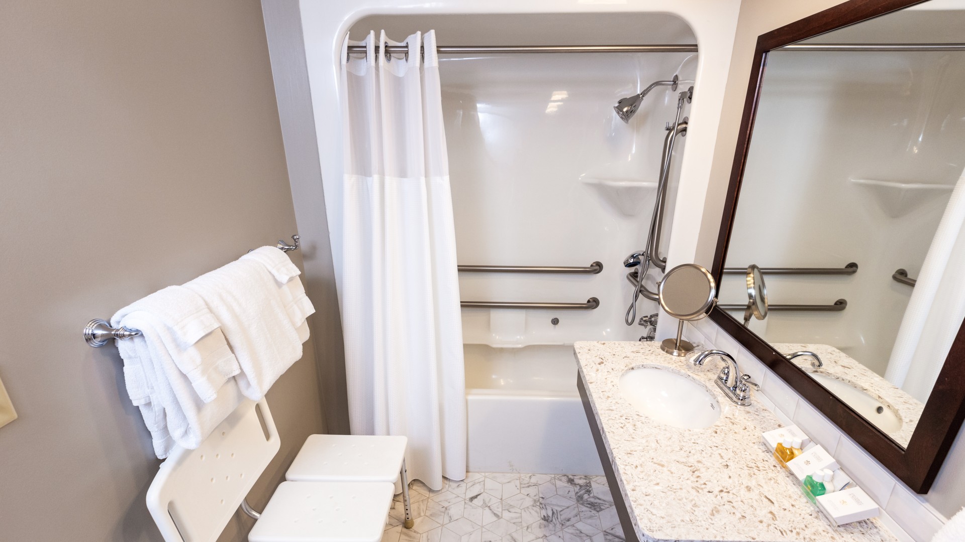 a bathroom with a shower and sink