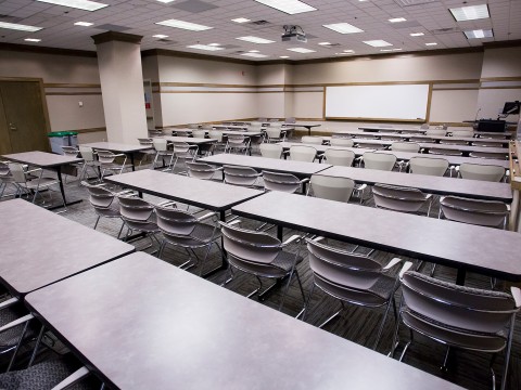 a room with tables and chairs