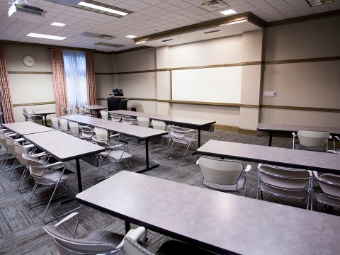 a room with tables and chairs