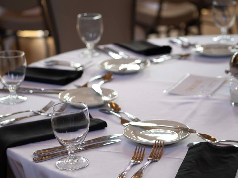 a table with plates and silverware