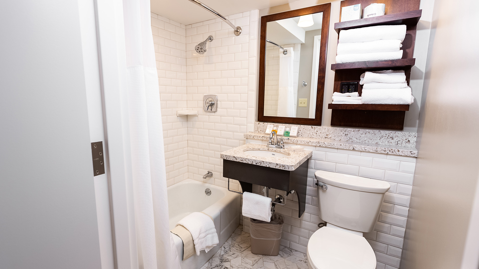 a bathroom with a sink toilet and bathtub