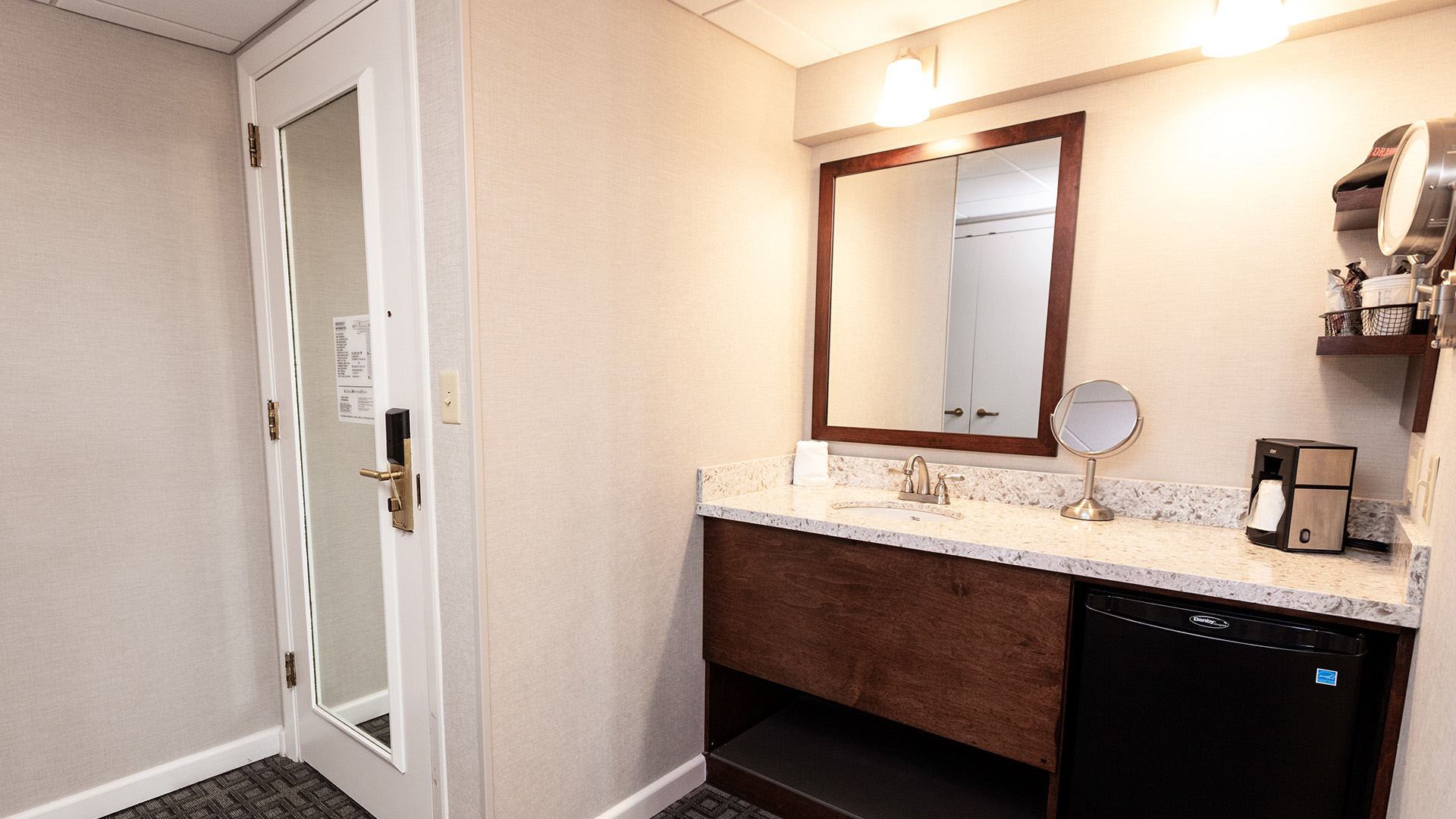 a bathroom with a mirror and sink