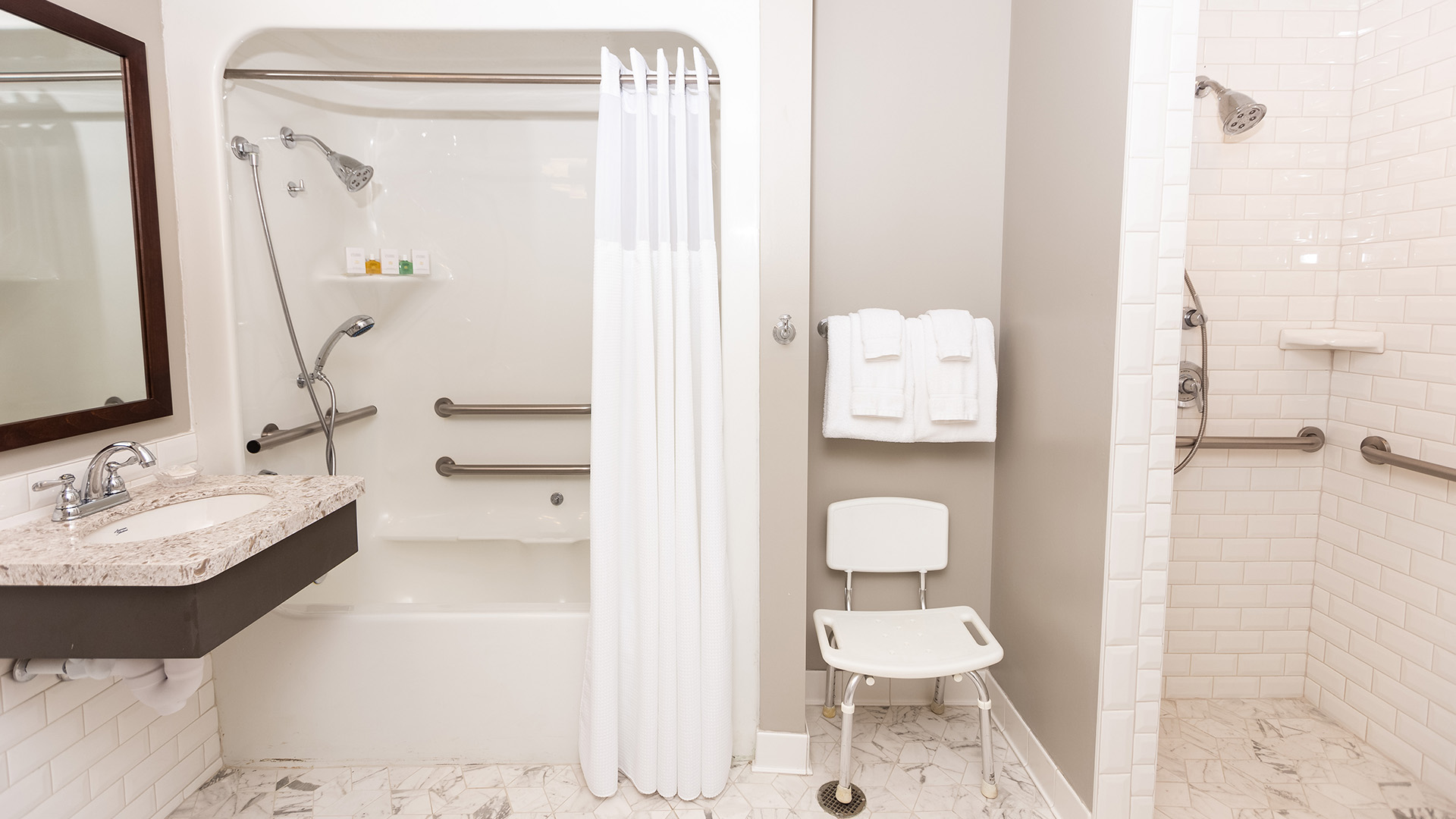 a bathroom with a shower and a chair