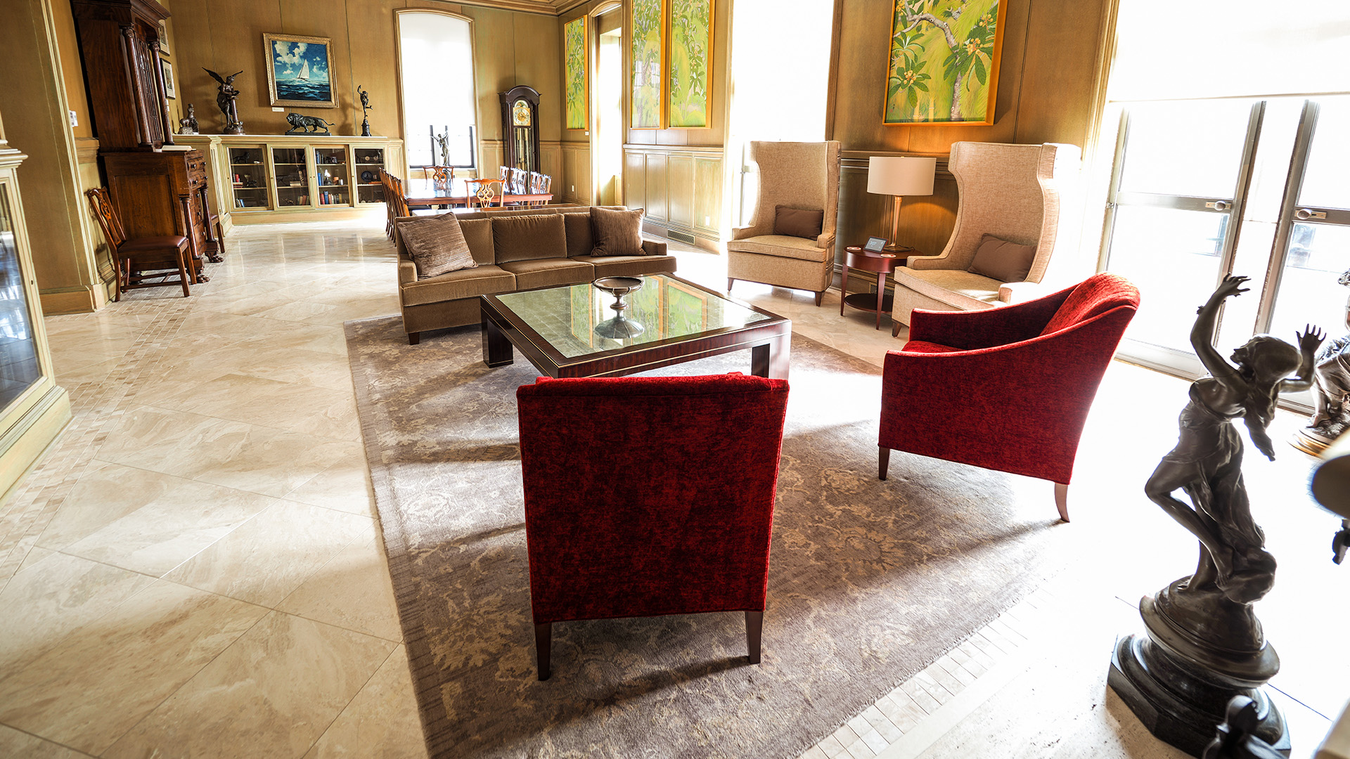 a room with a couch and chairs