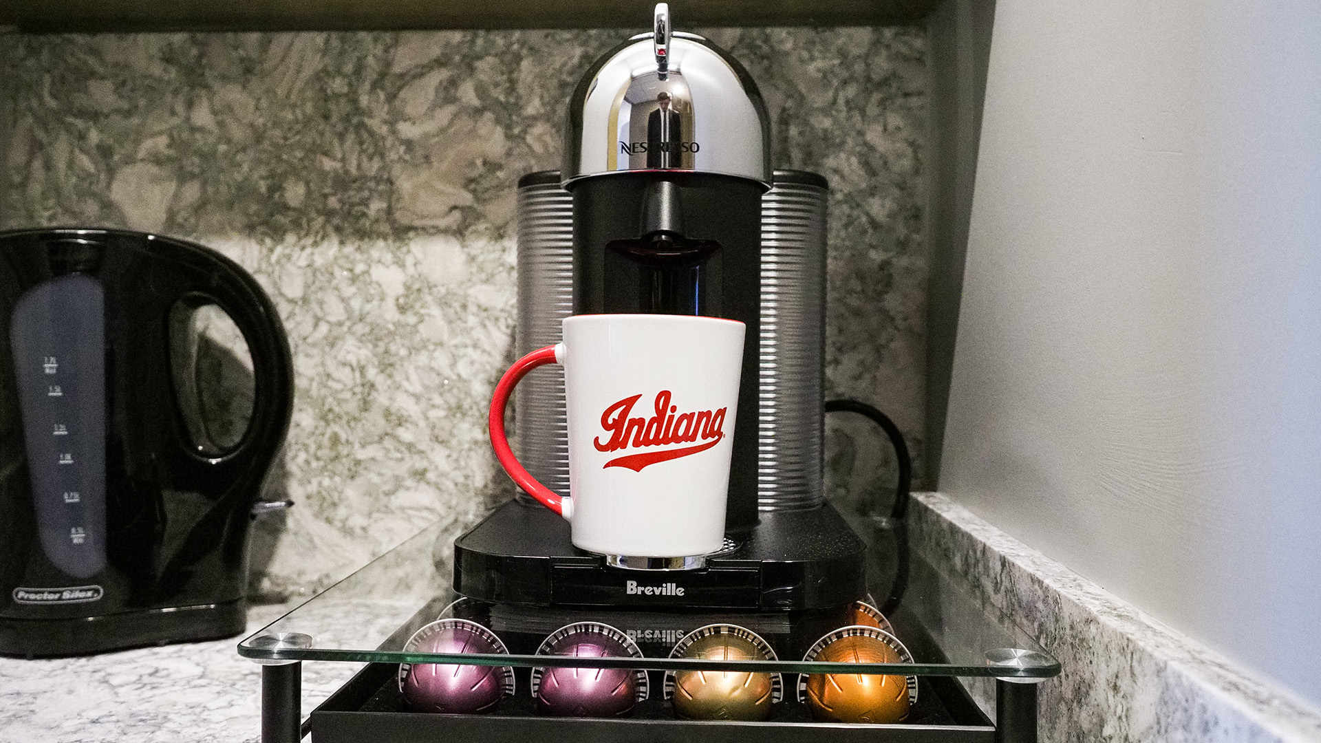 a coffee maker and a mug