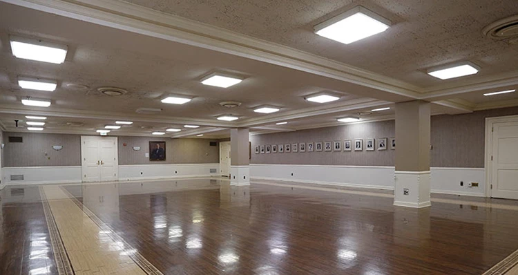 a room with a large floor and a large picture on the wall