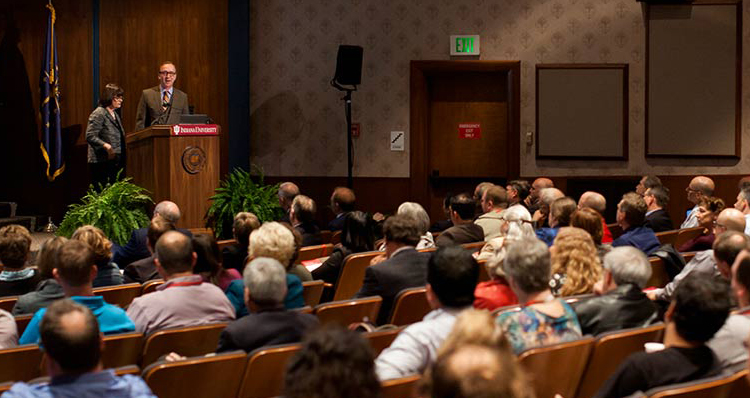 a man standing in front of a crowd of people