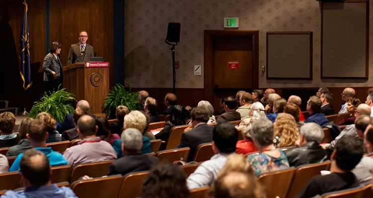 a man standing in front of a crowd of people