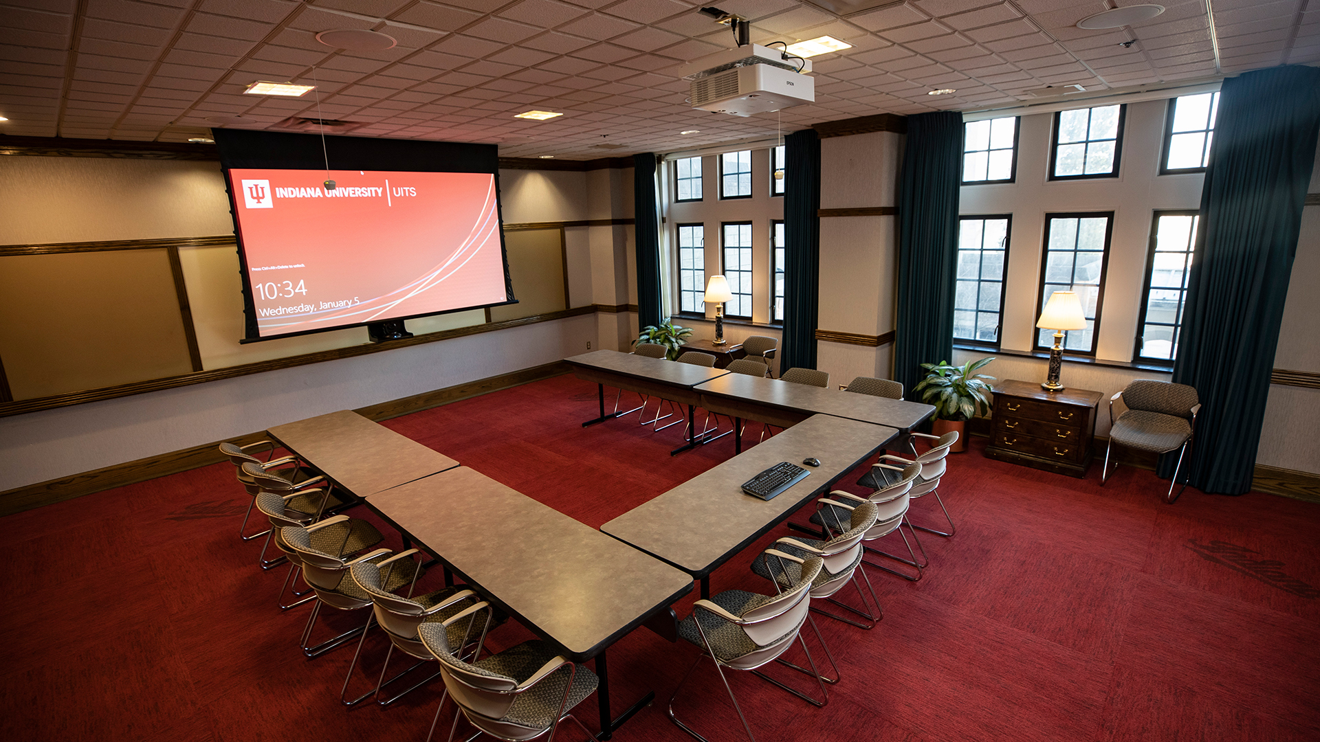 a room with a large table and chairs