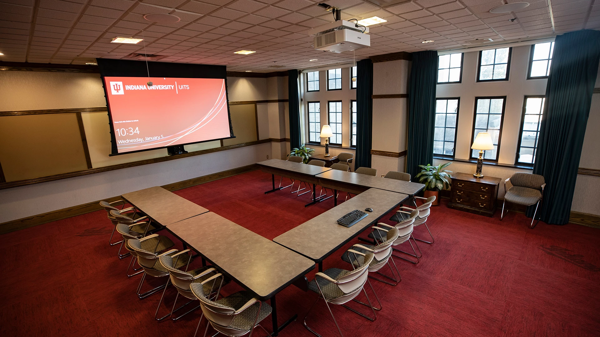 a room with a large table and chairs