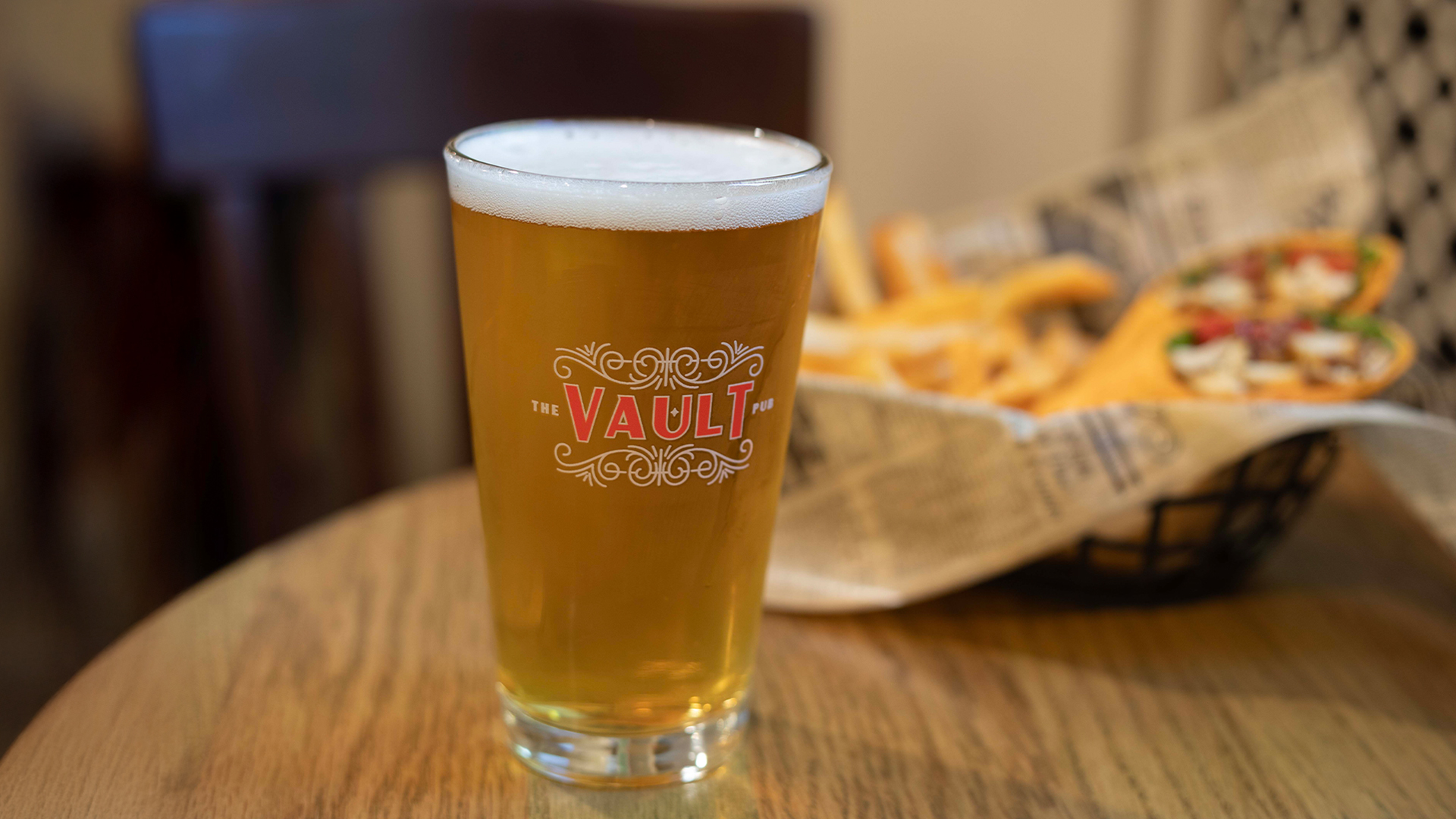 a glass of beer on a table