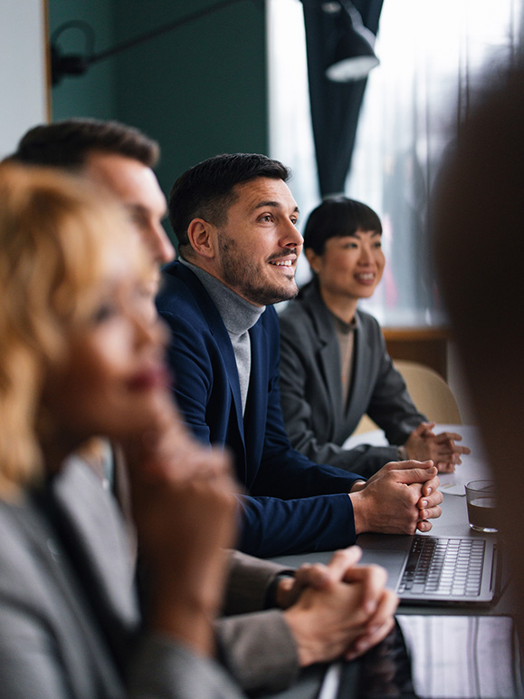 a group of people sitting at a table