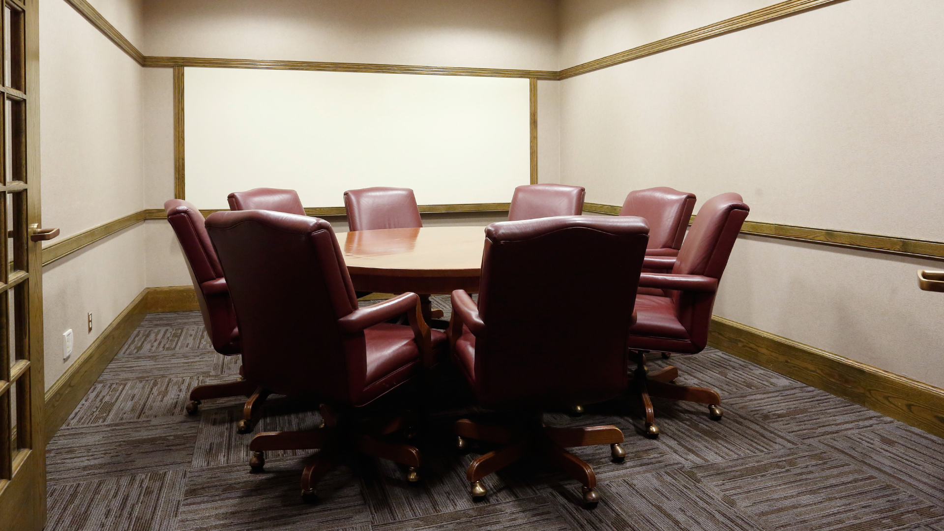 a conference room with a table and chairs