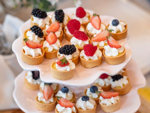 a plate of fruit tarts