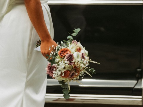 a person holding a bouquet of flowers