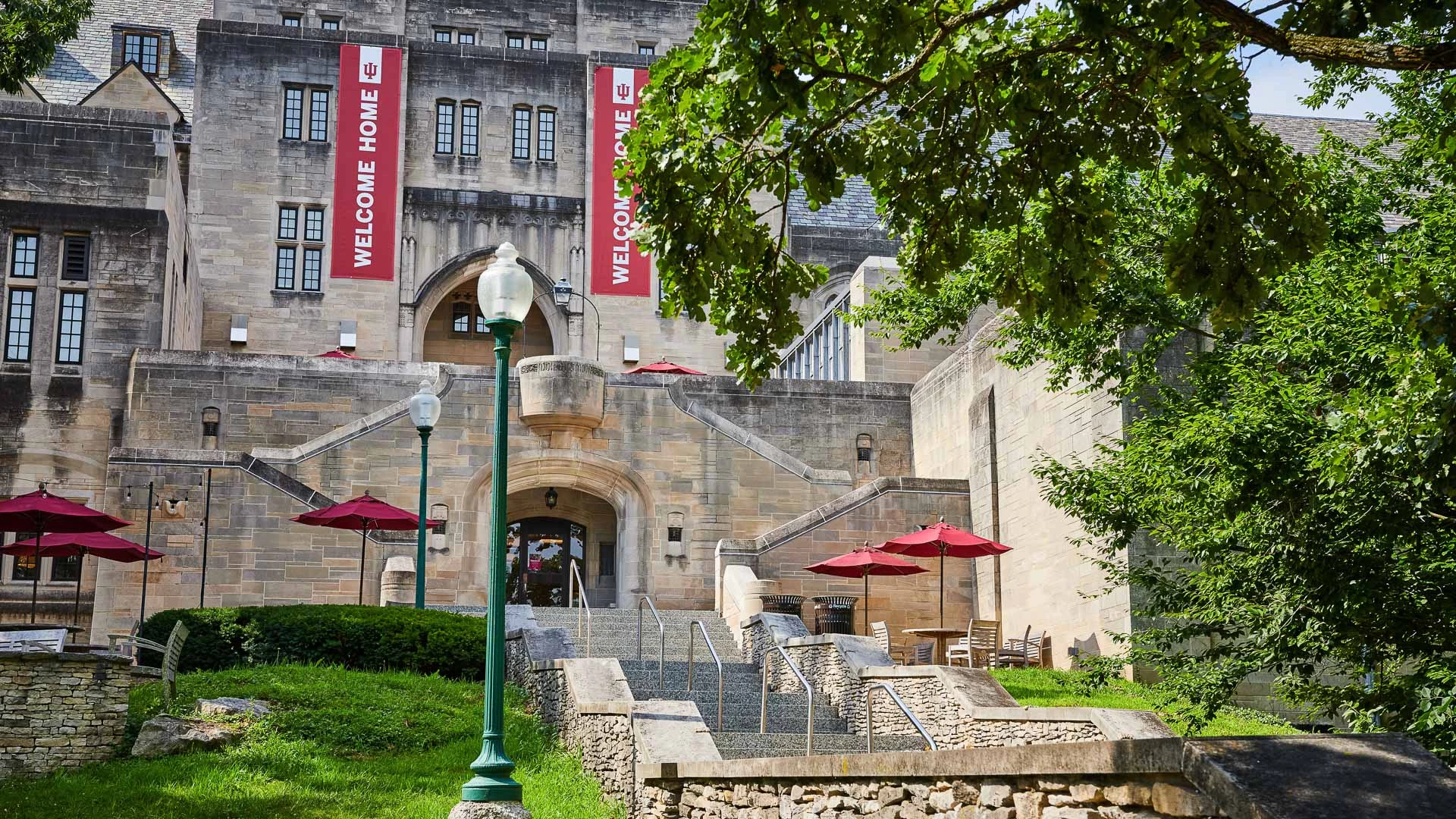 a building with stairs and umbrellas