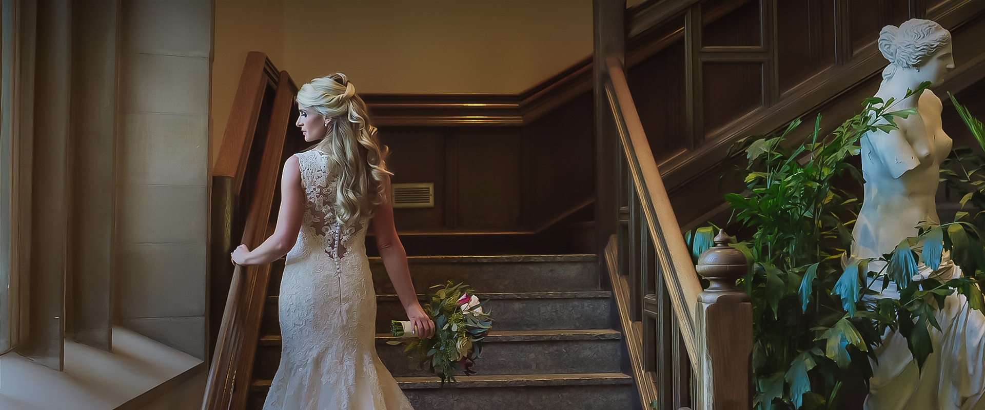 a woman in a wedding dress holding a bouquet of flowers