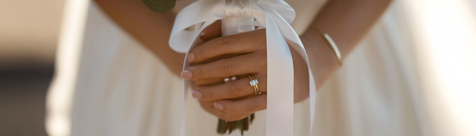 a hand holding a bouquet of flowers