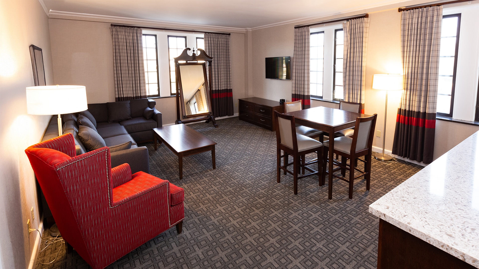 a room with a couch and a mirror