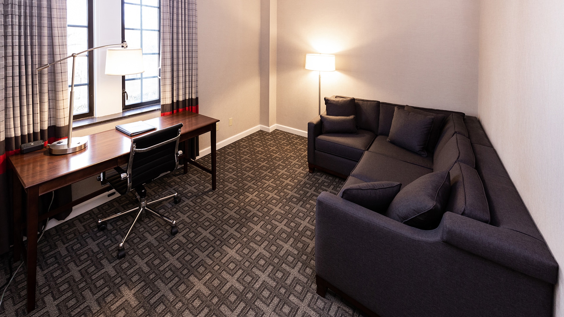 a room with a couch and a desk