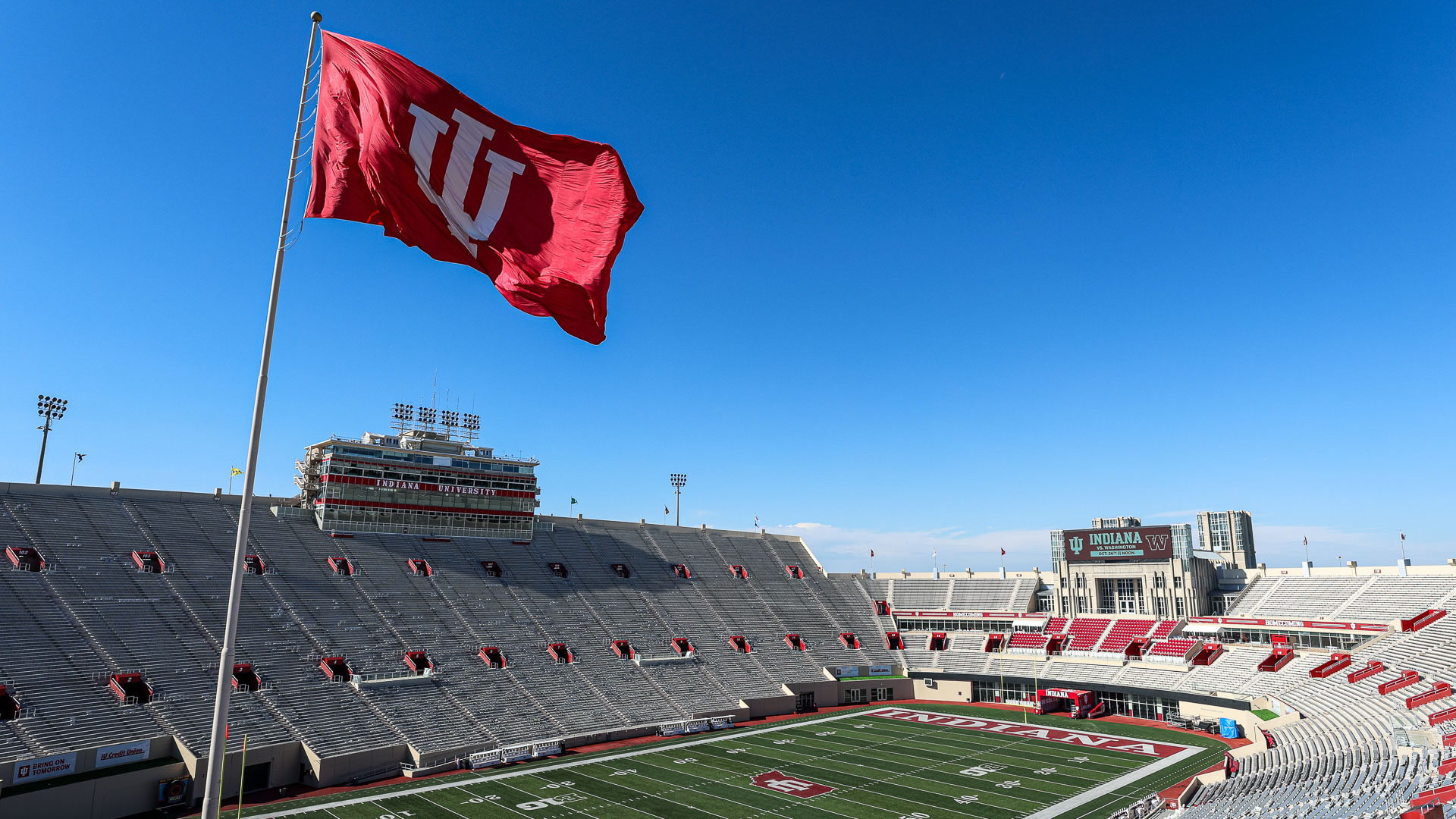 a stadium with a flag flying over it