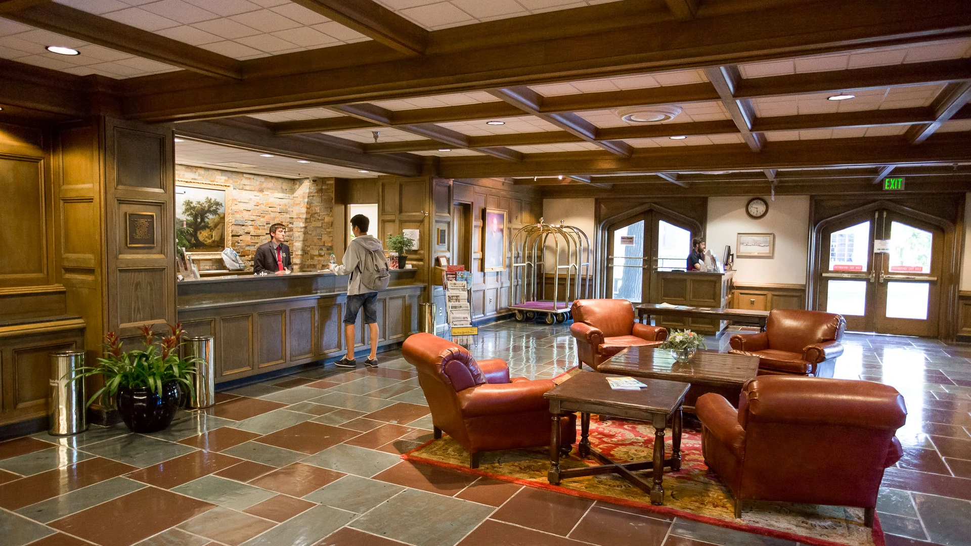 a lobby with a reception desk and chairs