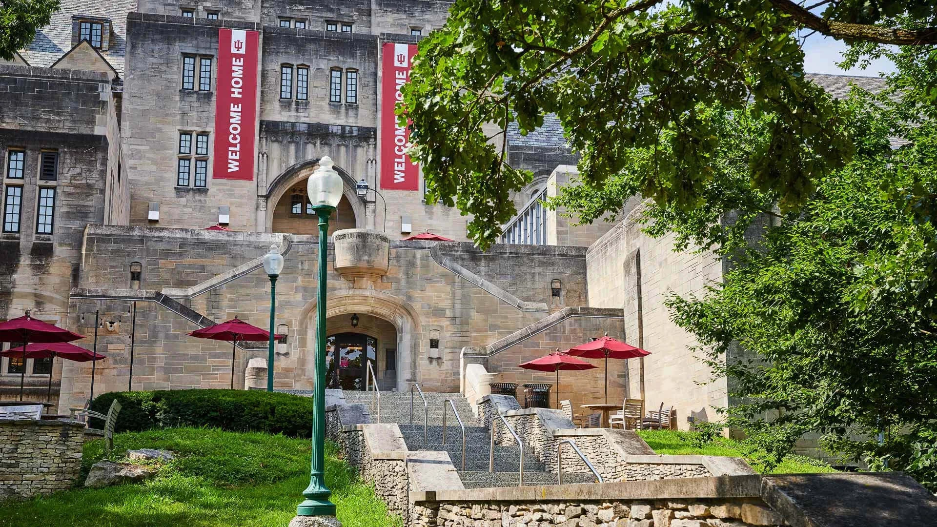 a building with stairs and umbrellas