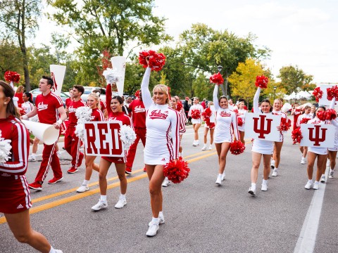 a group of cheerleaders in a parade
