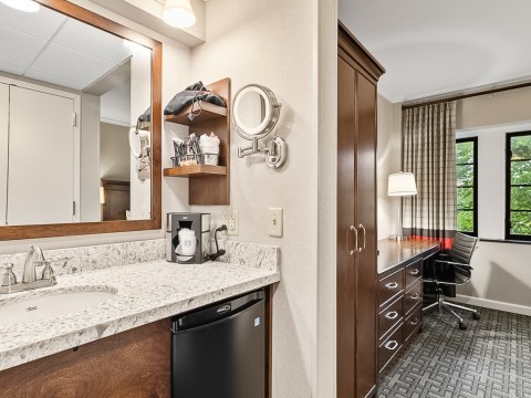 a bathroom with a mirror and a sink