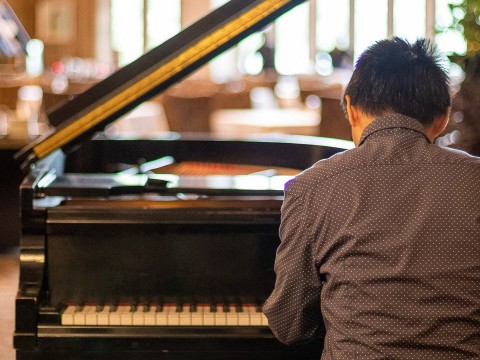 a man playing a piano