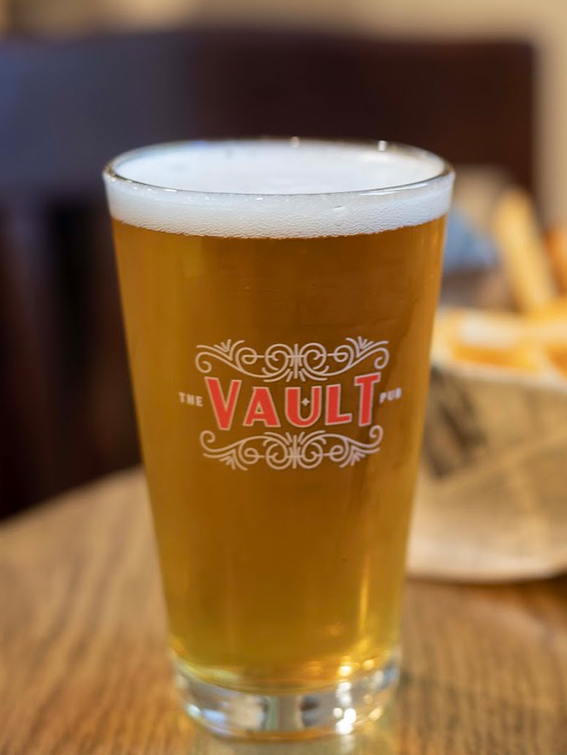 a glass of beer on a table