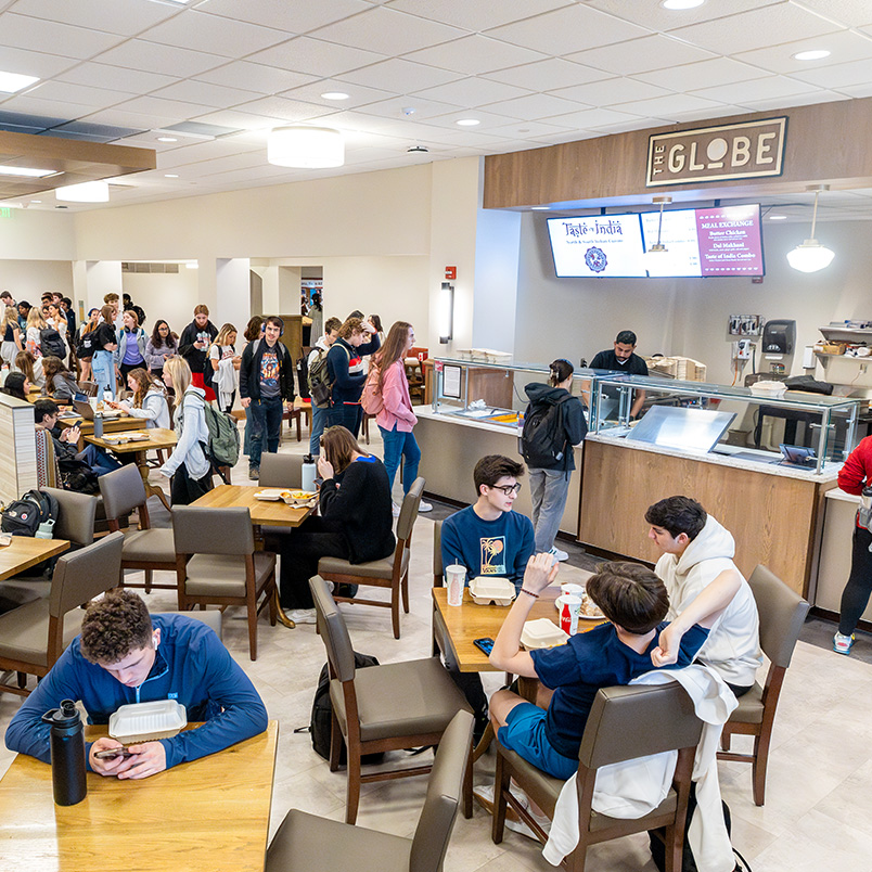 a group of people in a cafeteria