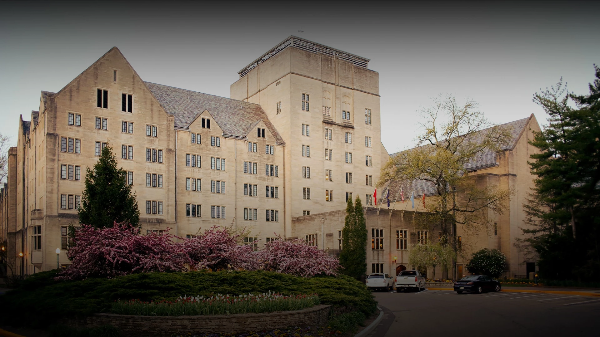 a building with trees and bushes