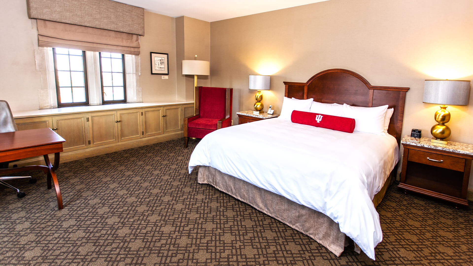 a hotel room with a bed and a chair