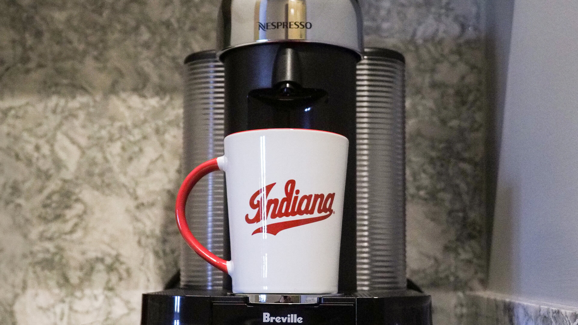 a coffee machine with a mug on it