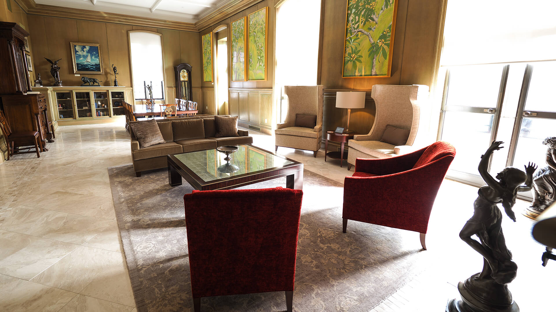 a room with a couch and chairs