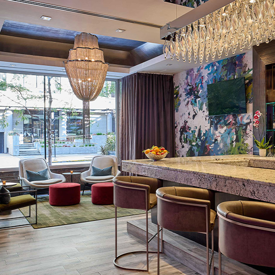 a room with a bar and chairs