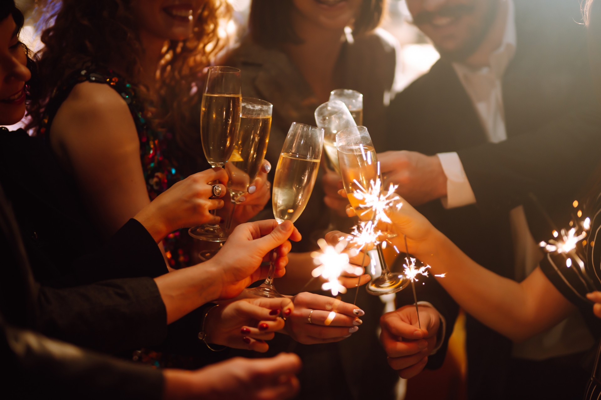 a group of people holding champagne glasses