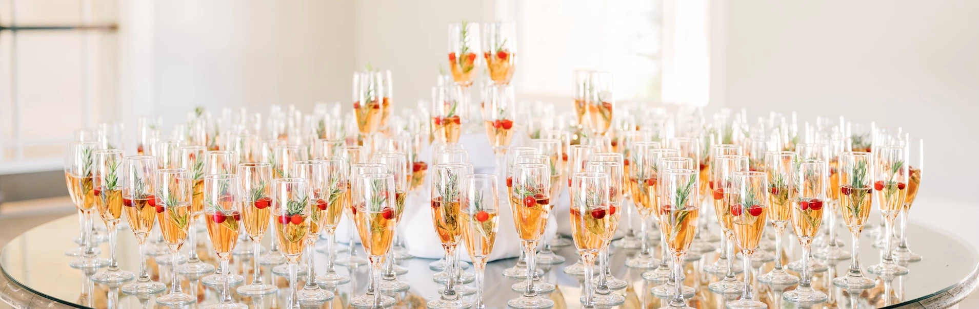 a group of glasses filled with champagne