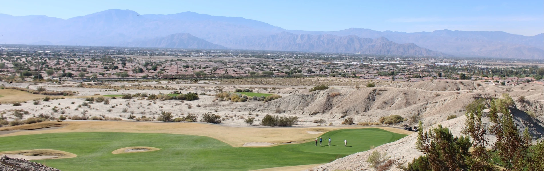 a group of people on a golf course