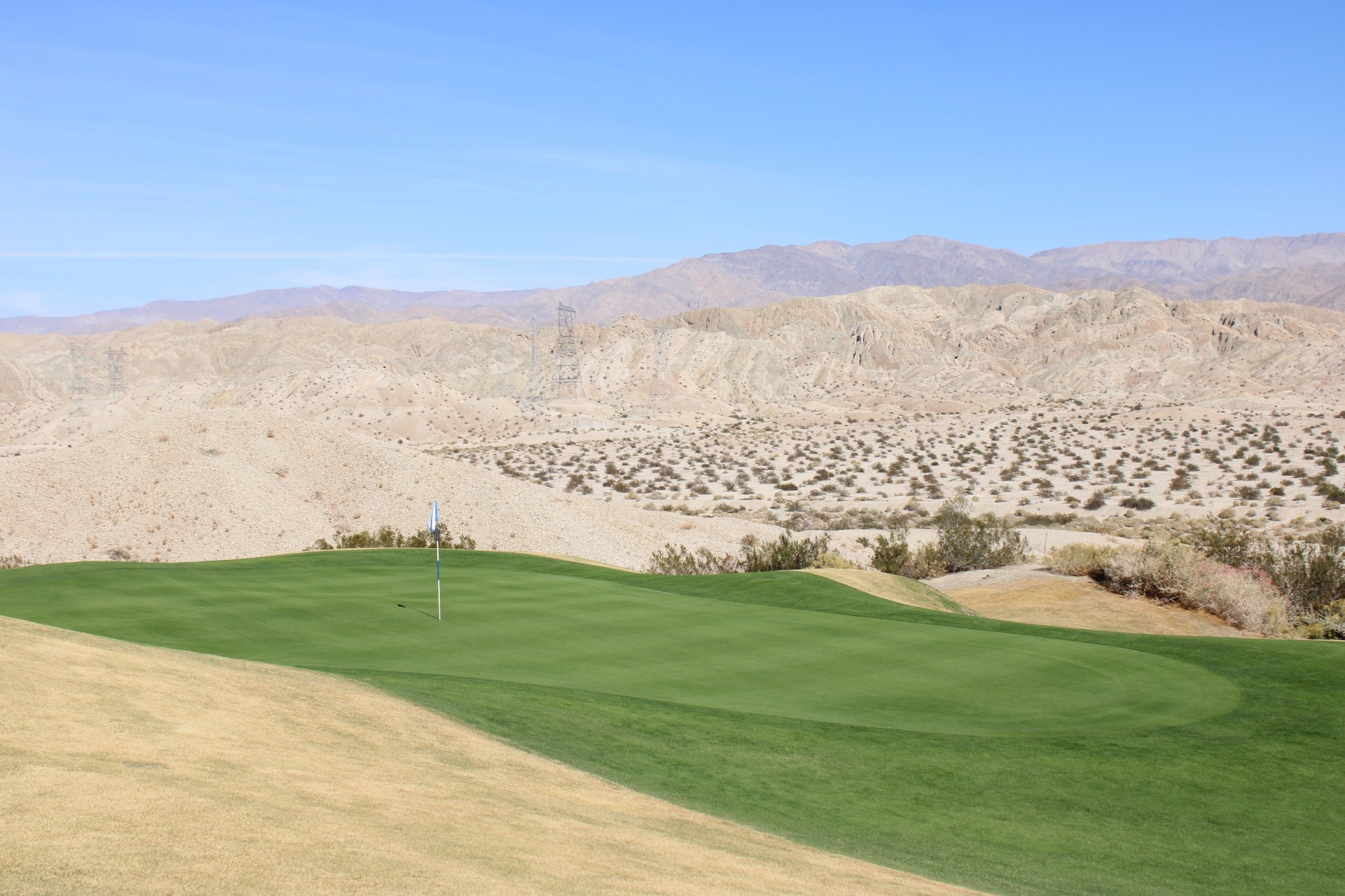 a golf course with a flag on the green