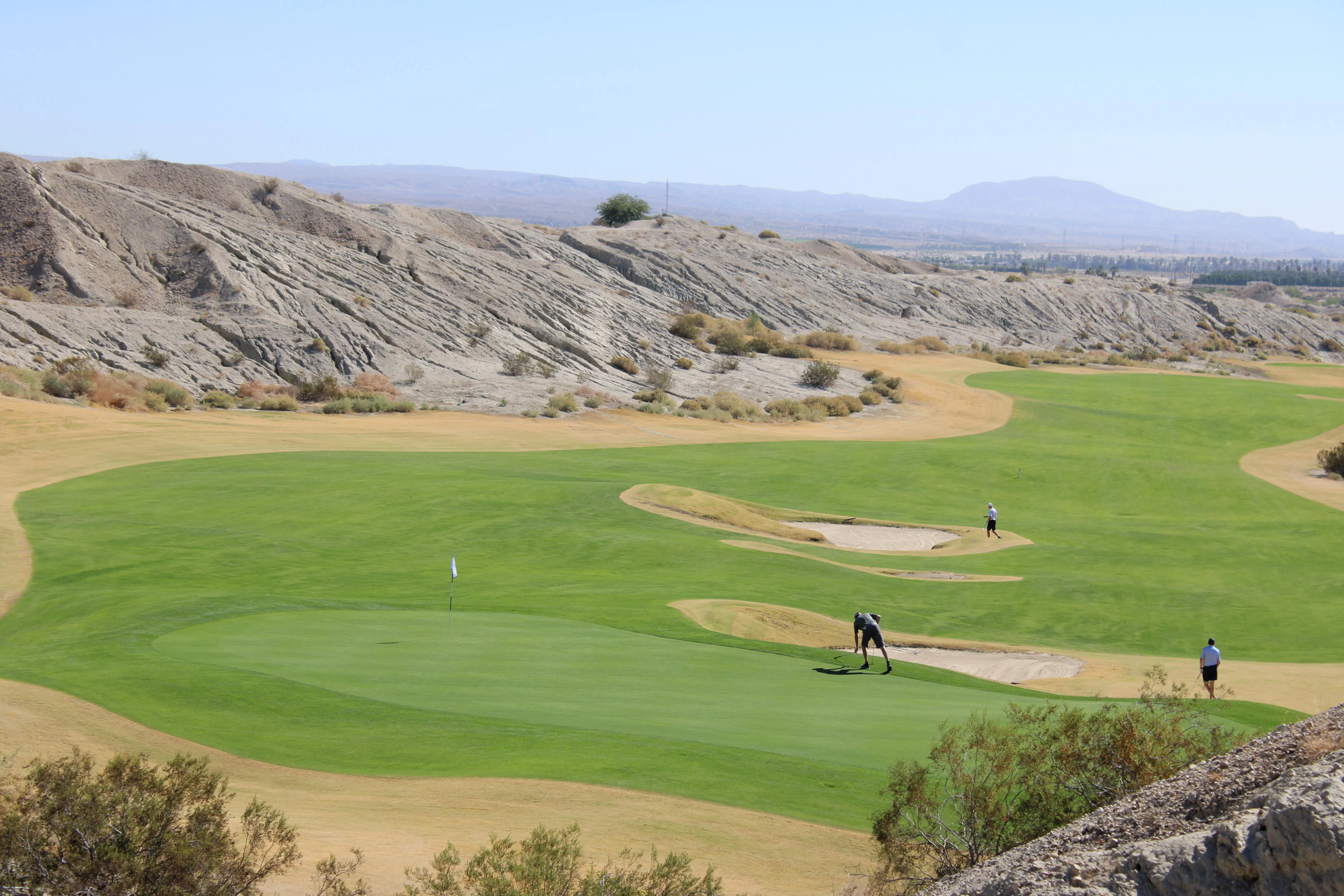 a group of people playing golf