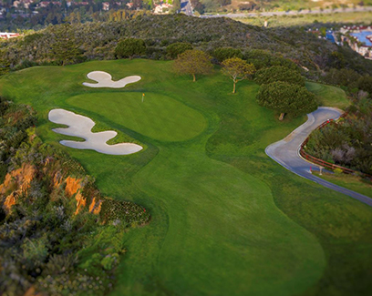 drone shot of the property with the clay ledges, sand dunes, and paved road