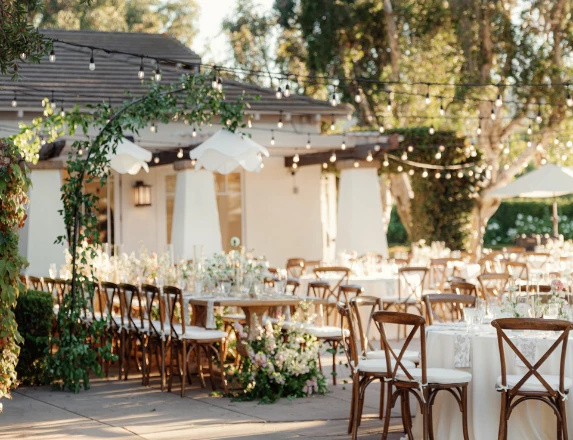 a group of tables and chairs outside