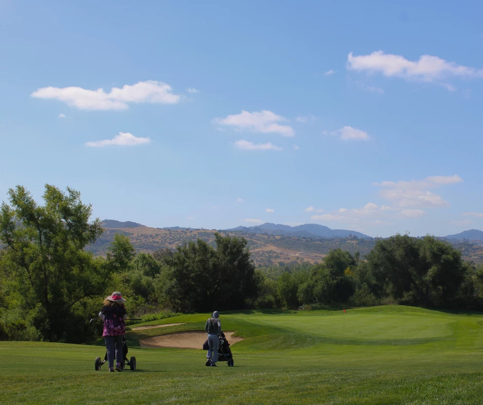 a group of people on a golf course