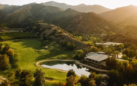 glen ivy golf course view from above with a small lake in the center
