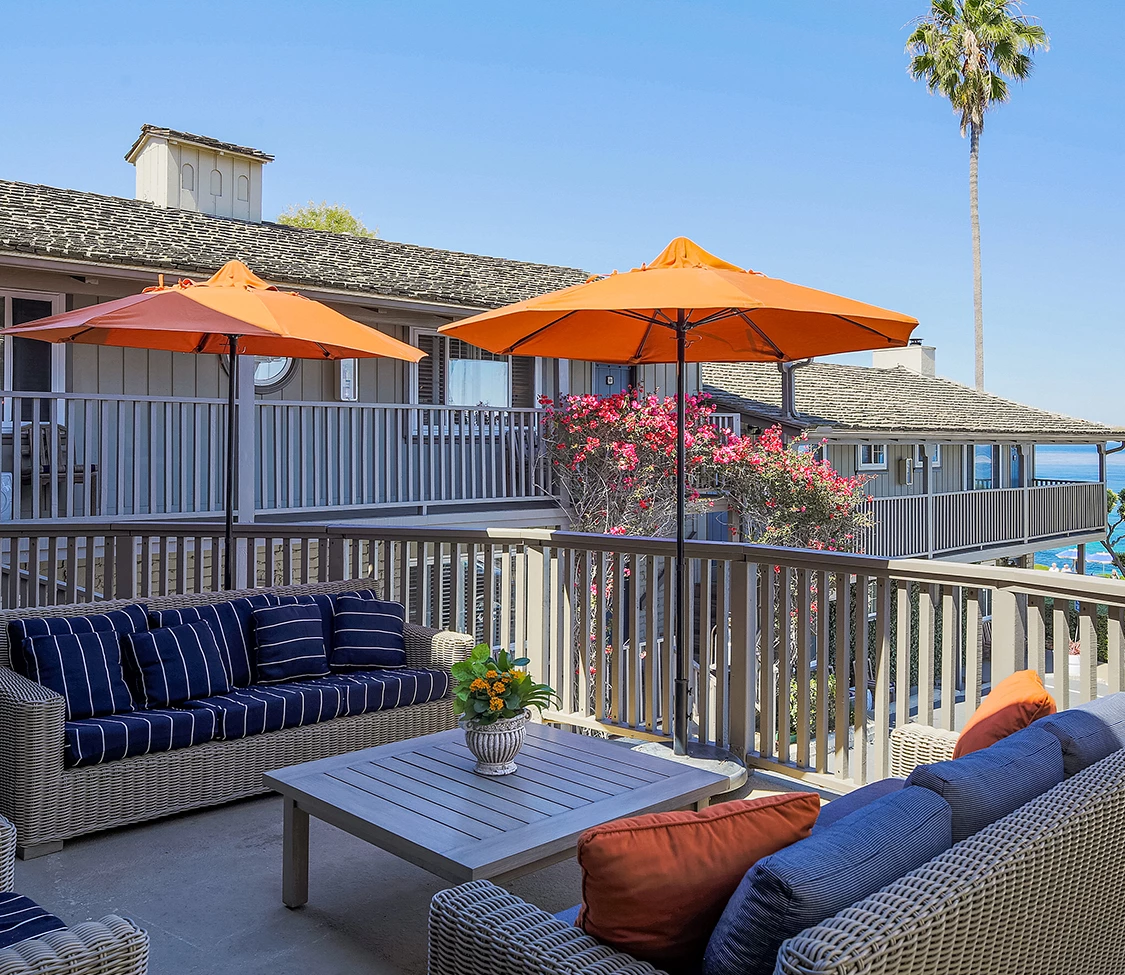 a patio with a table and chairs