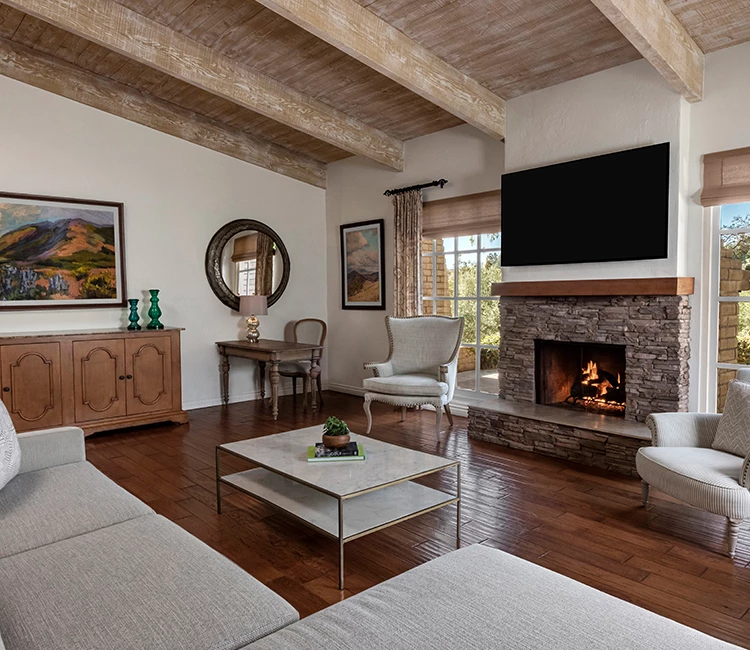 a living room with a fireplace and couches