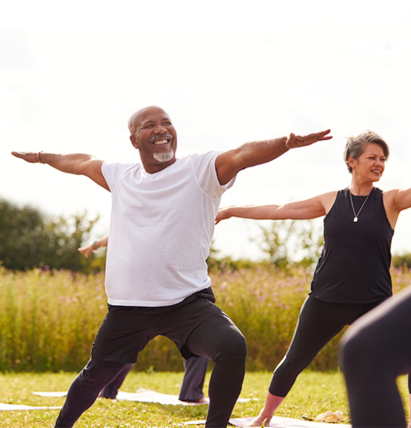 two people gathered doing yoga