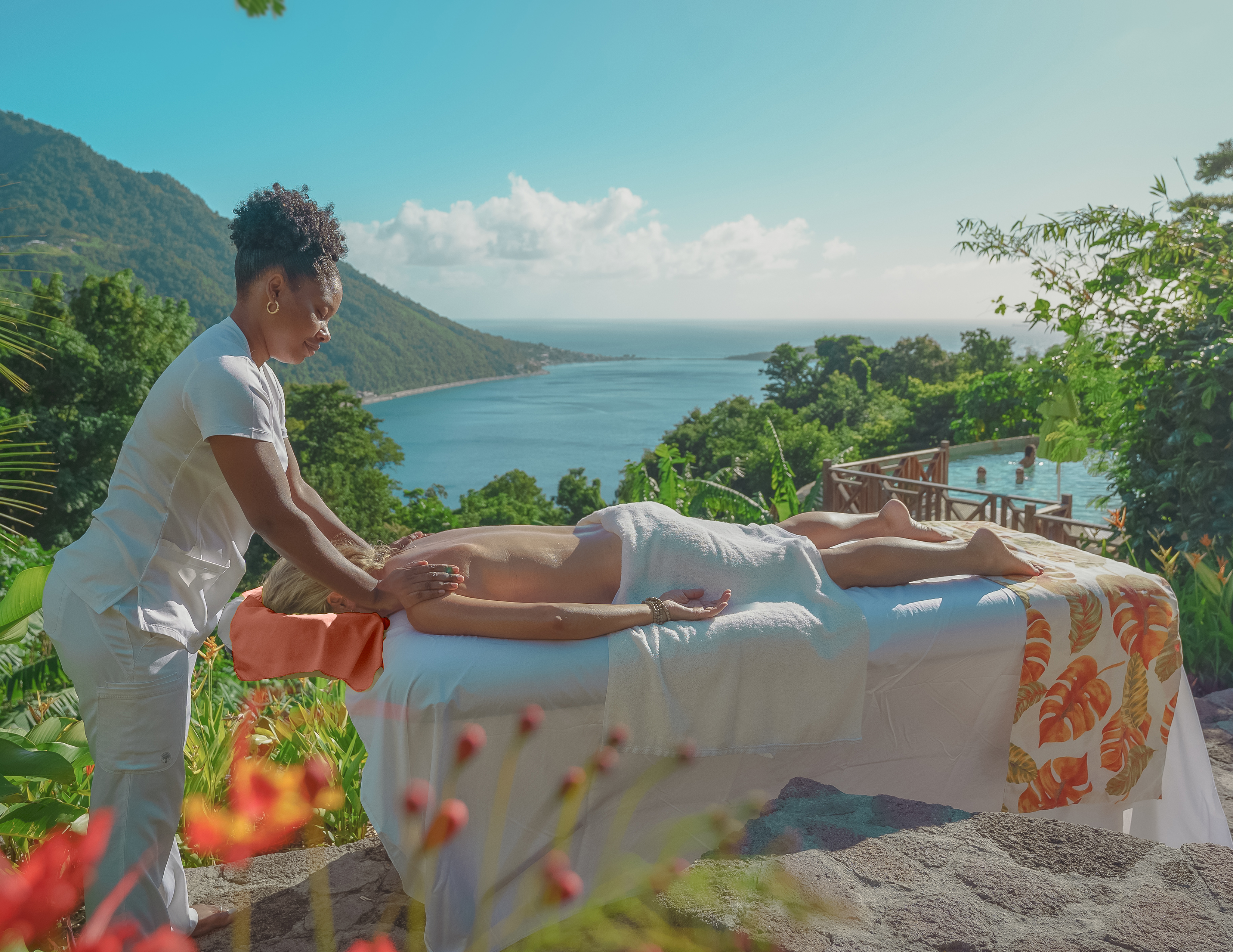 a woman getting a massage on a bed outside